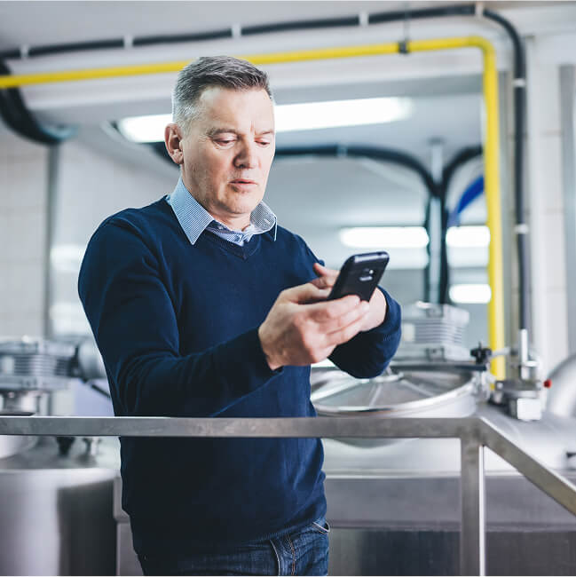 Man monitors food safety on his phone